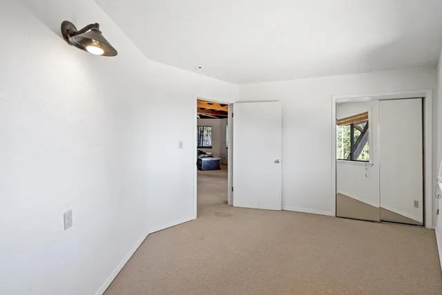 a view of a chairs and table in the patio