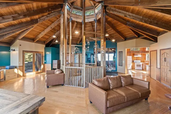 a large kitchen with stainless steel appliances granite countertop a stove and a sink