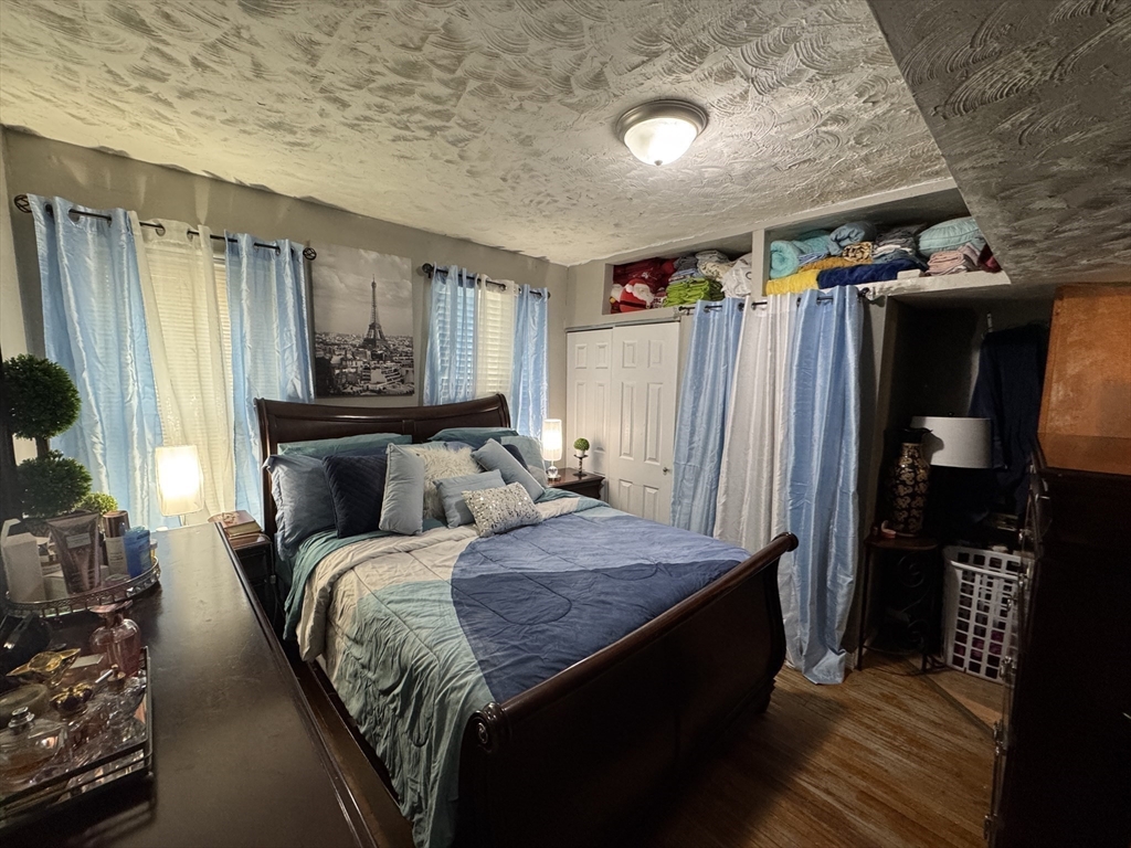 27 Harlow Street Worcester, MA 01605 - Photo 11 of 32 a bed room with a bed and a window