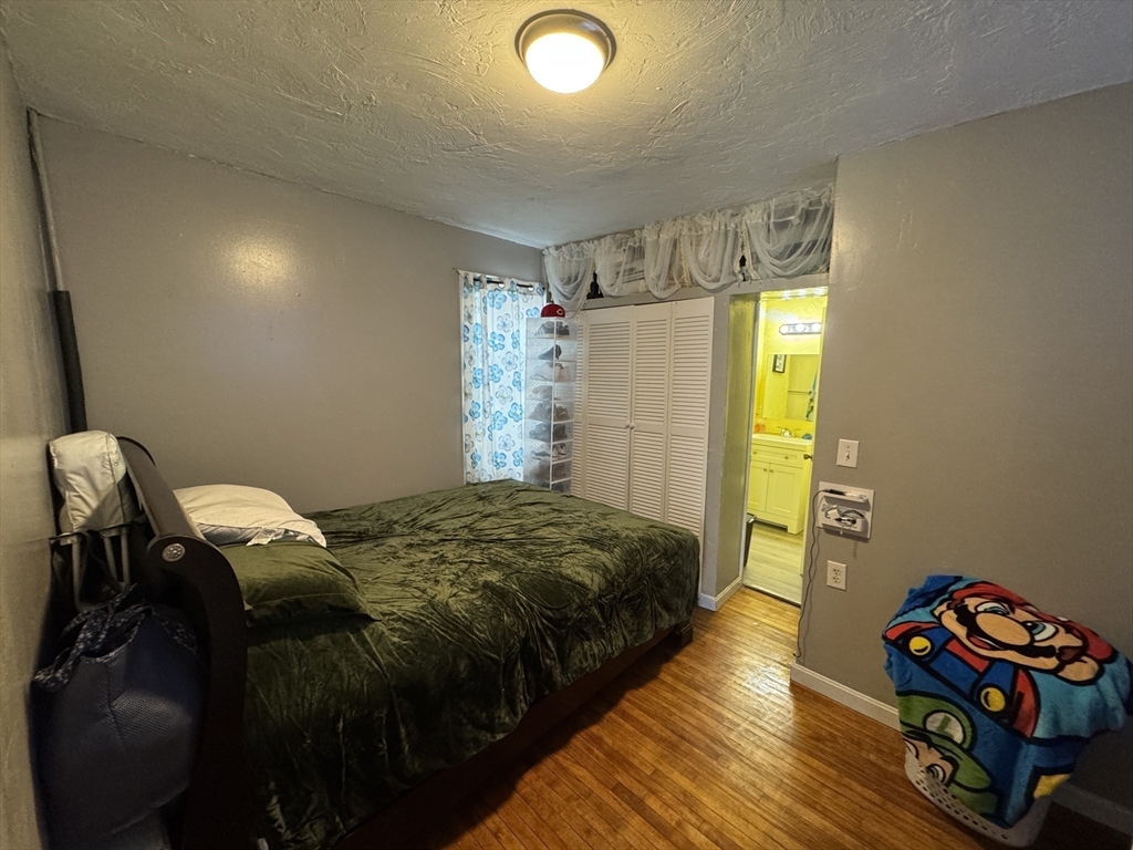 27 Harlow Street Worcester, MA 01605 - Photo 13 of 32 a bedroom with bed and a window