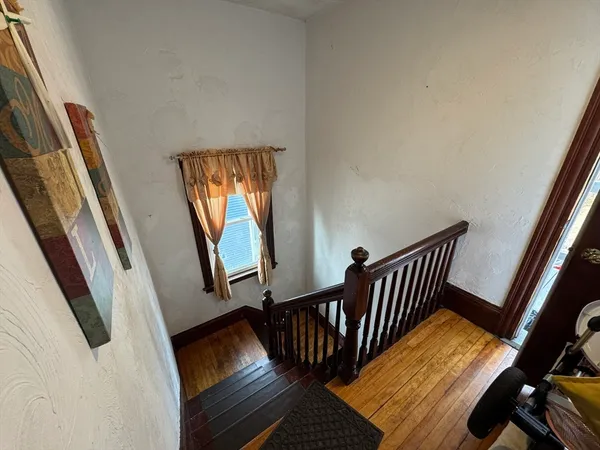 a view of deck with furniture and staircase