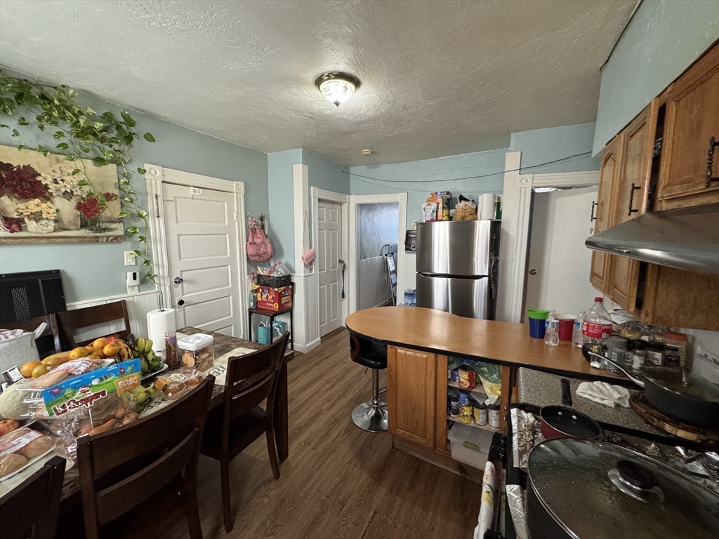 27 Harlow Street Worcester, MA 01605 - Photo 18 of 32 a room with furniture and a wooden floor