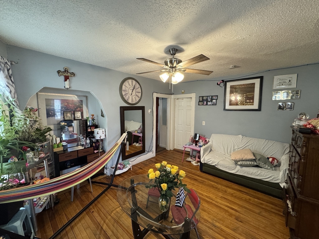 27 Harlow Street Worcester, MA 01605 - Photo 19 of 32 a living room with furniture and a wooden floor