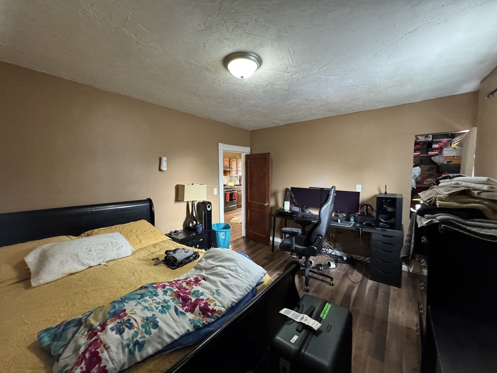 27 Harlow Street Worcester, MA 01605 - Photo 25 of 32 a bed room with a bed and furniture