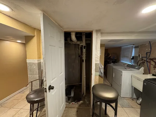 a room with a chair and tables