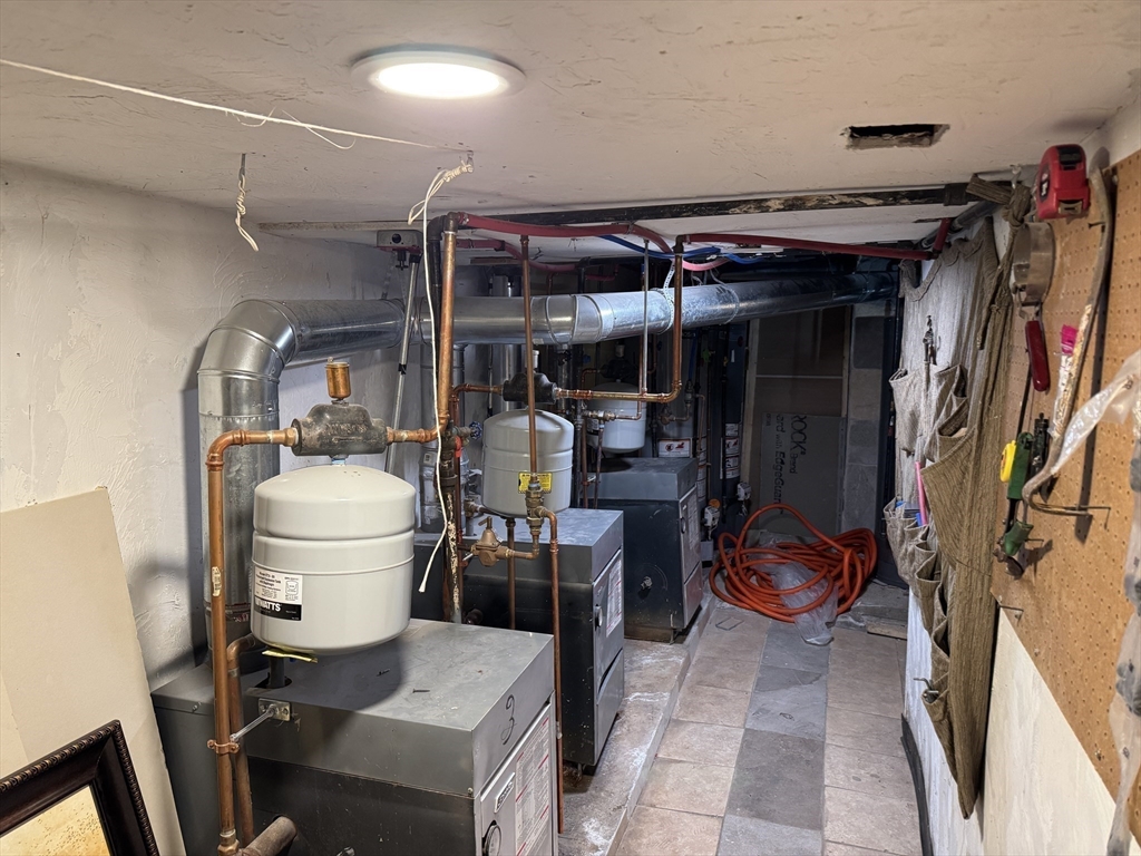 27 Harlow Street Worcester, MA 01605 - Photo 30 of 32 a room with wooden furniture and storage