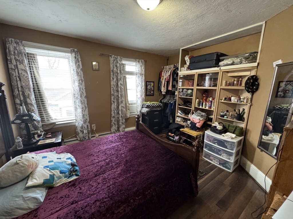 27 Harlow Street Worcester, MA 01605 - Photo 10 of 32 a bedroom with bed and wooden floor