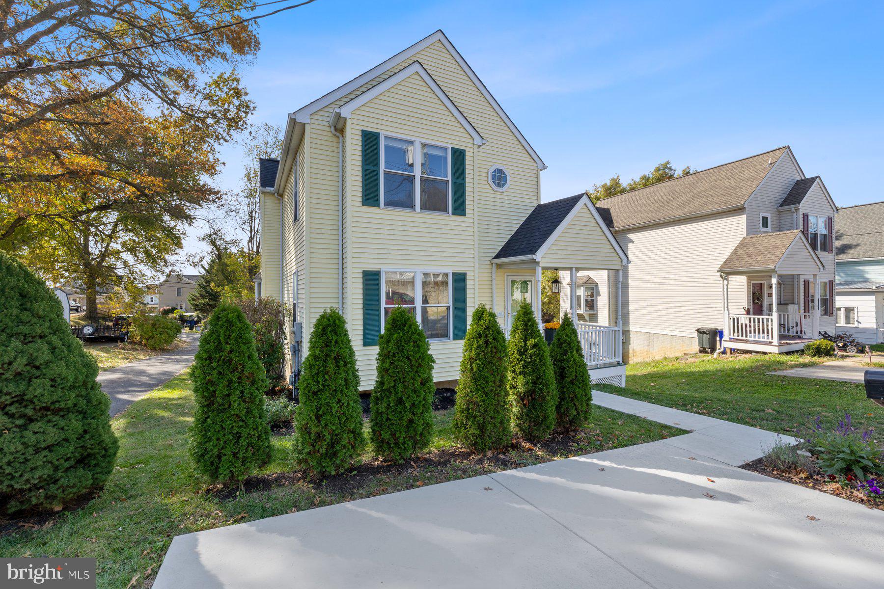 822 East B Street Brunswick, MD 21716 - Photo 2 of 42 a front view of a house with a garden