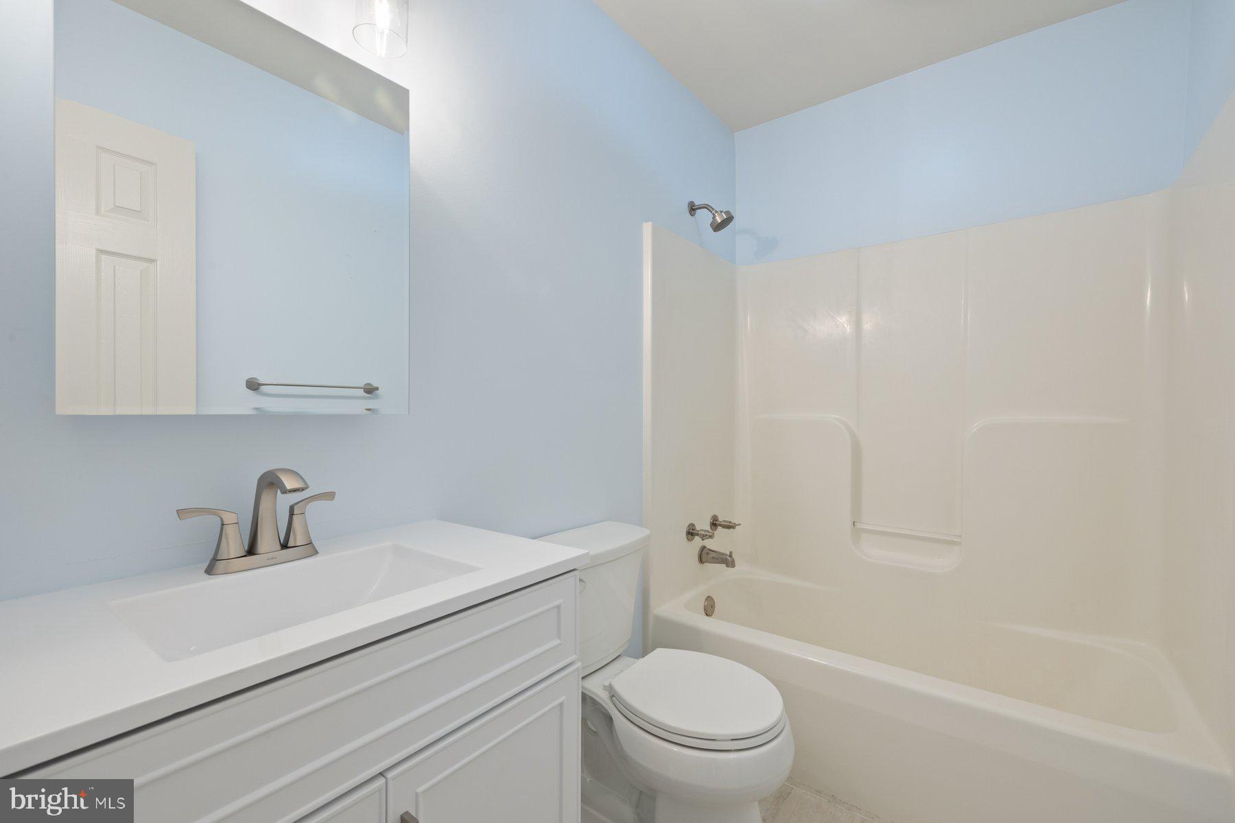 822 East B Street Brunswick, MD 21716 - Photo 25 of 42 a bathroom with a sink a toilet and shower