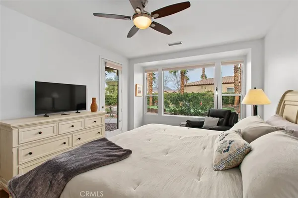 a bathroom with a granite countertop sink mirror and shower