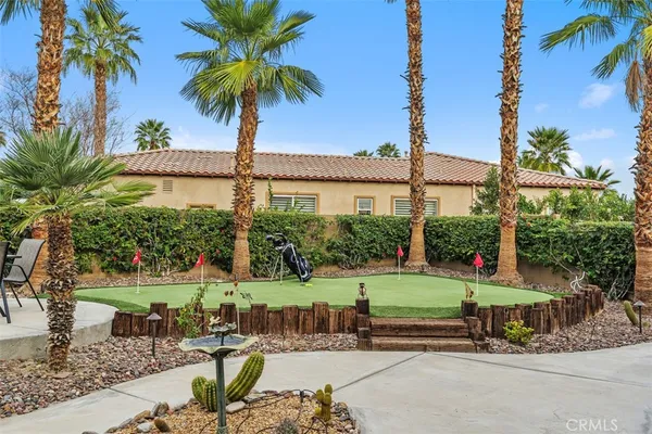 a view of a backyard with palm trees
