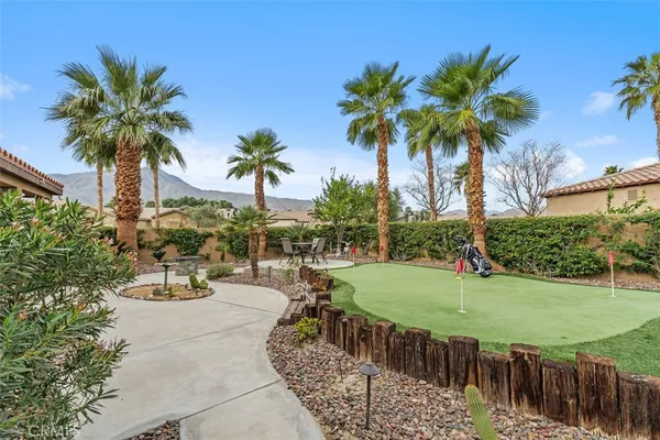 a view of outdoor space with palm trees