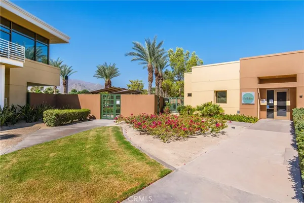 a view of a swimming pool with a lawn chairs