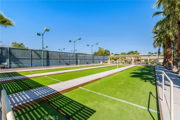a view of a backyard with swimming pool