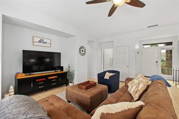 a living room with furniture and a large window