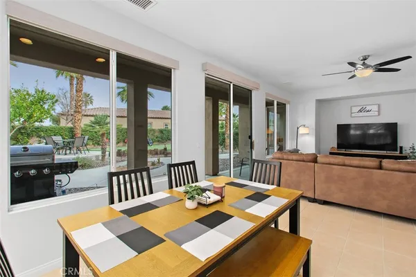 a kitchen with a refrigerator a stove a sink a counter top space and cabinets