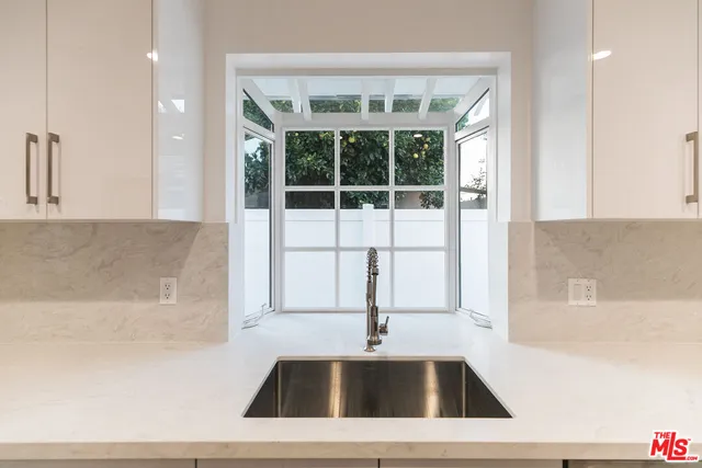 a kitchen with a sink and a bathtub