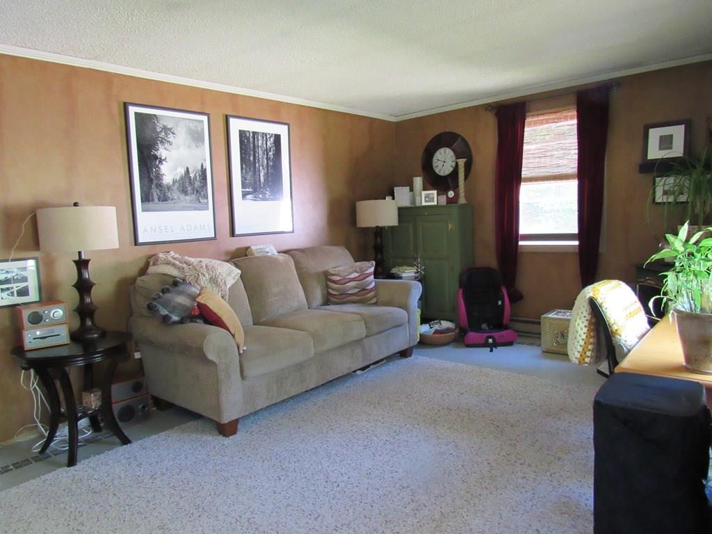 3 Wolf Creek Road Cape Neddick, ME 03902 - Photo 9 of 17 The living room is nice and bright.