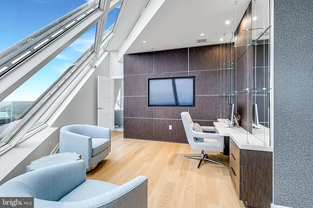 a workspace with furniture and a potted plant