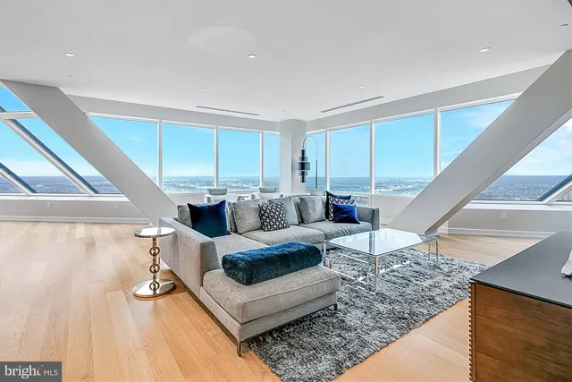a living room with furniture and a rug