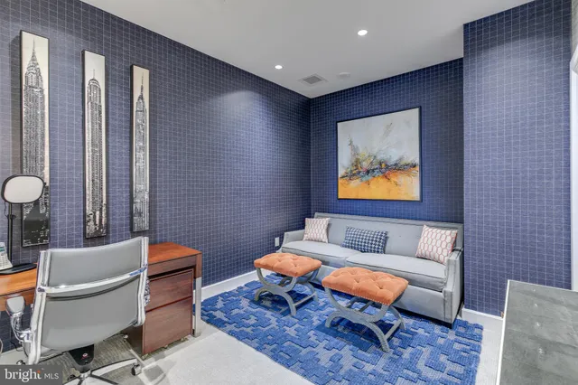 a living room with furniture a rug and a table