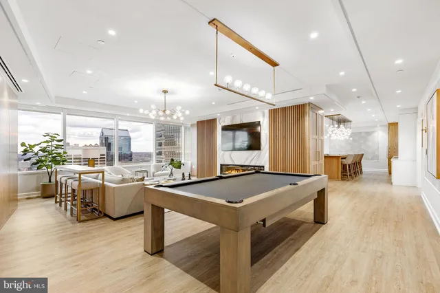a large kitchen with a table and chairs