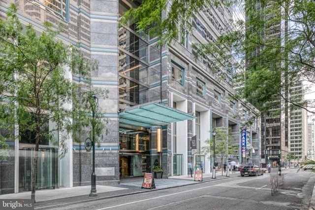 a view of a brick building next to a road