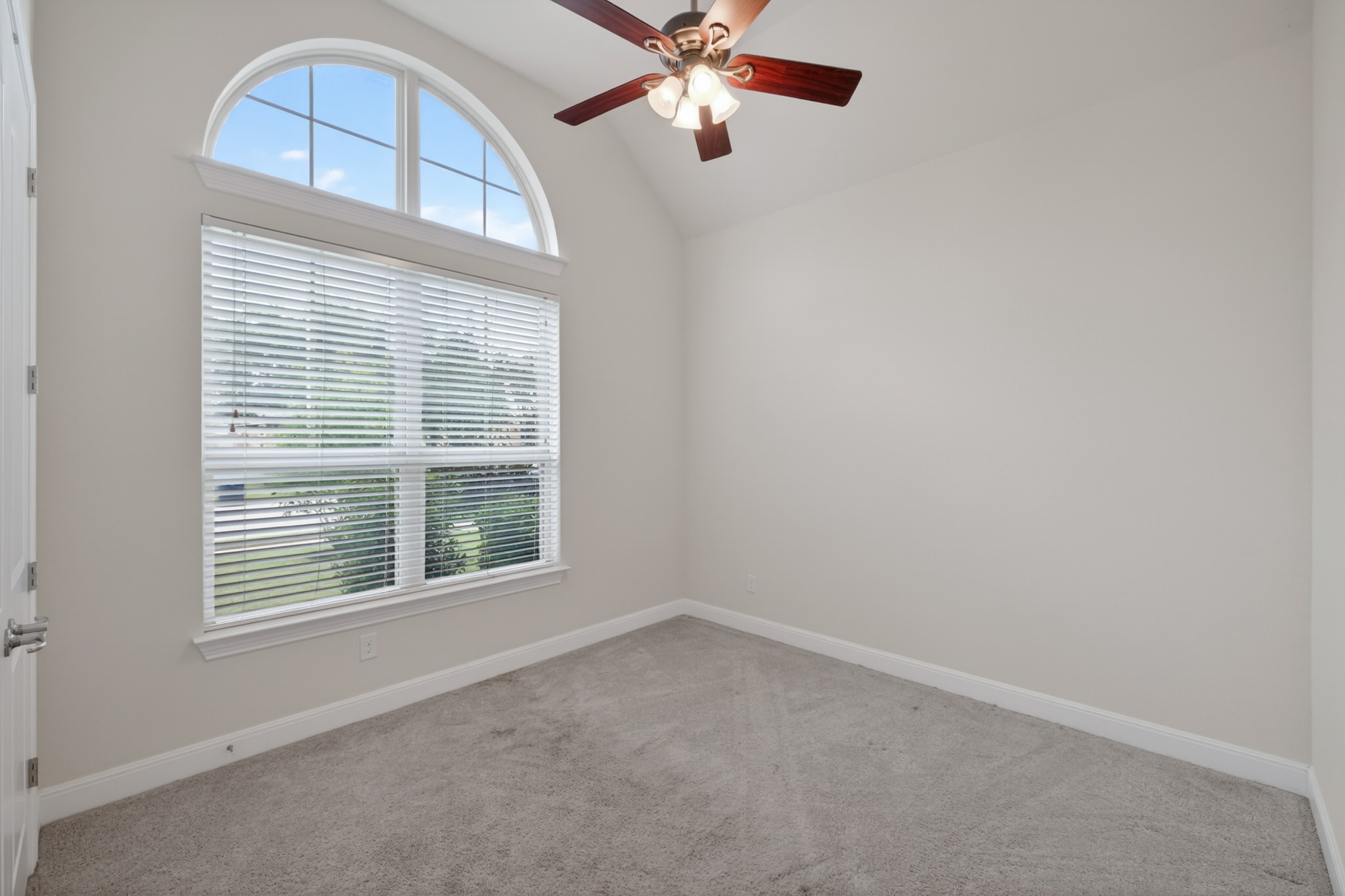 1017 Tabernash Leander, TX 78641 - Photo 26 of 38 Vaulted ceiling room featuring a large arched window, complete with blinds