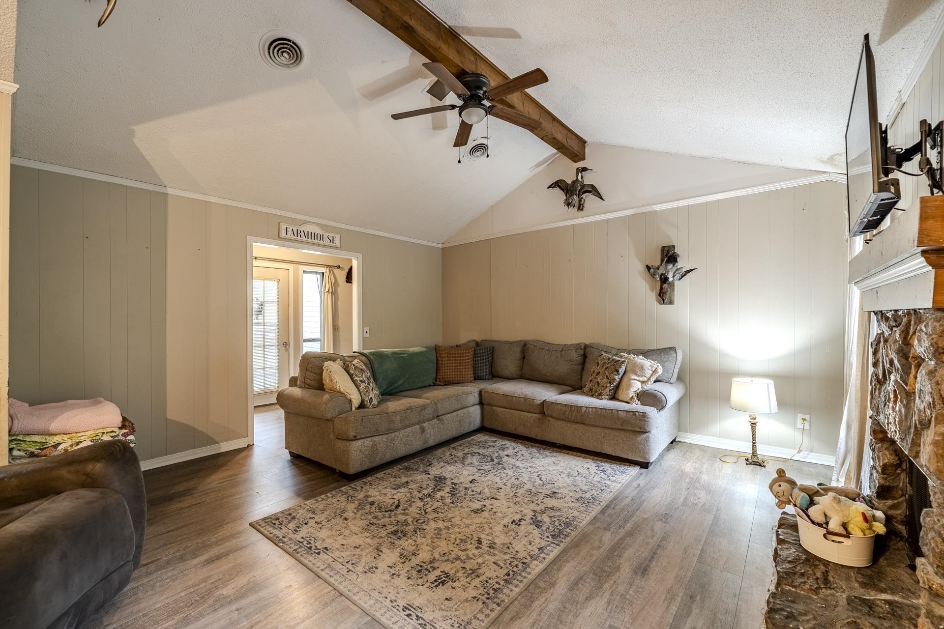 259 Oakview Drive Adamsville, TN 38310 - Photo 5 of 32 Vaulted ceiling with an exposed wood beam and ceiling fan
