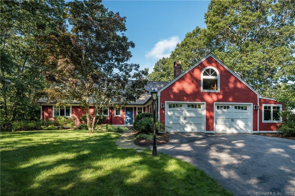 a view of house with a yard