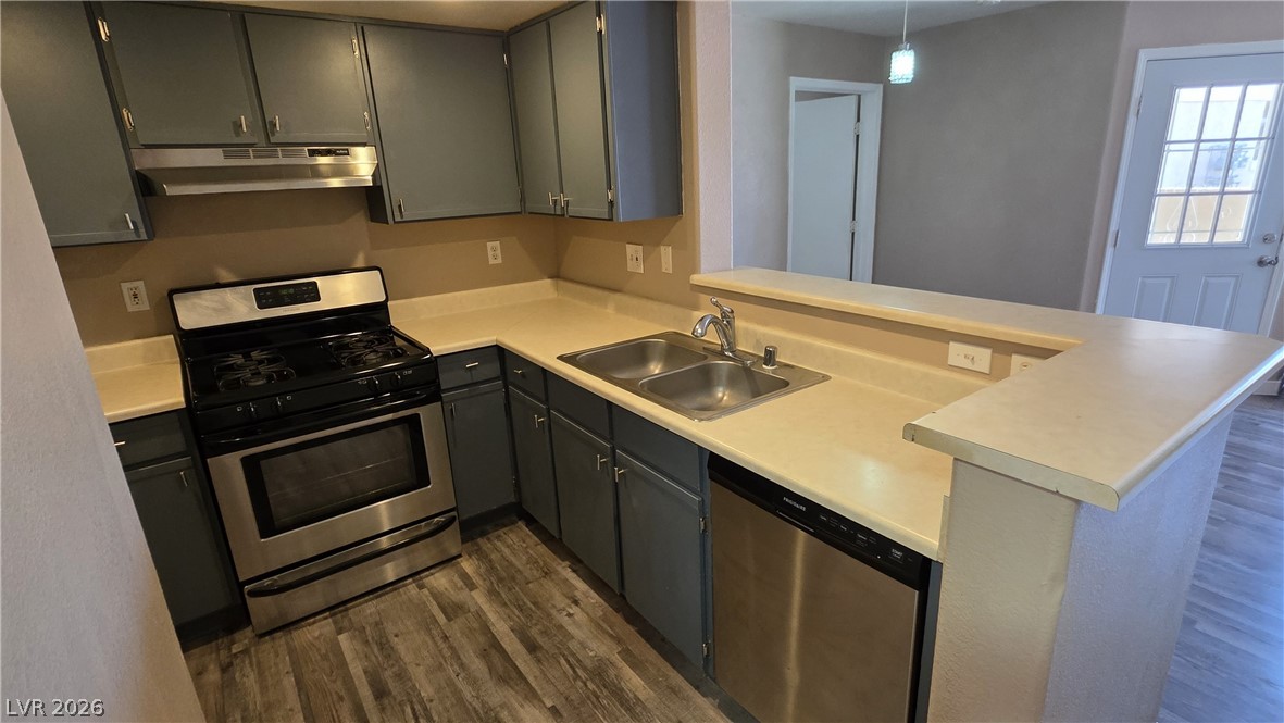 1830 North Pecos Road, Unit 142 Las Vegas, NV 89115 - Photo 10 of 19 Functional kitchen with ample counter space and integrated stainless steel appliances.