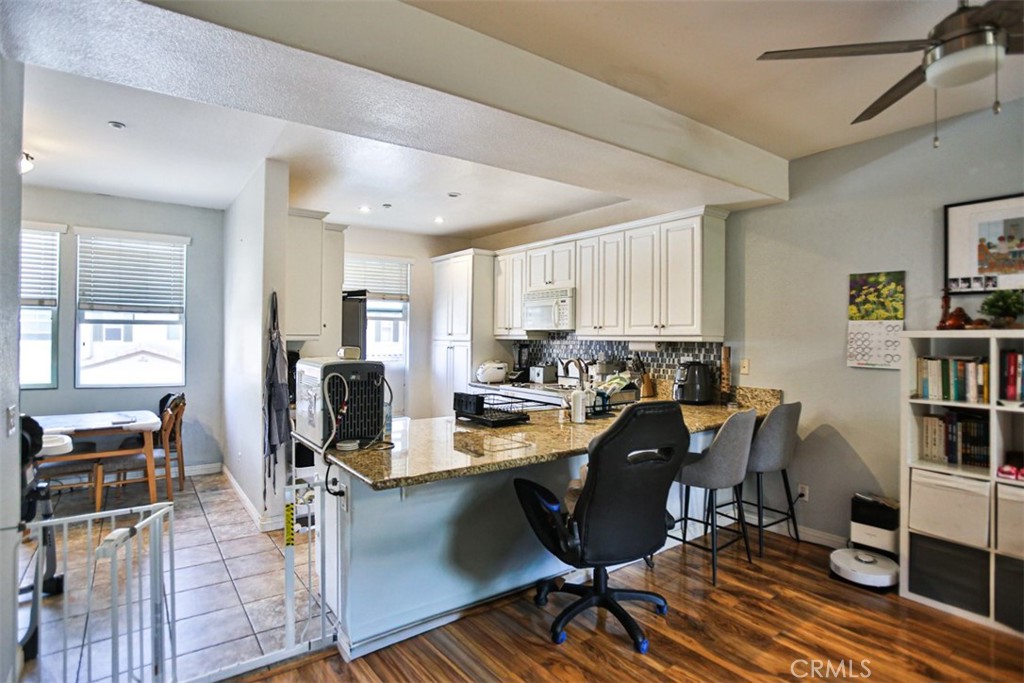8796 Aspenglow Place, Unit 2 Santee, CA 92071 - Photo 13 of 41 a view of a dining room with furniture window and wooden floor