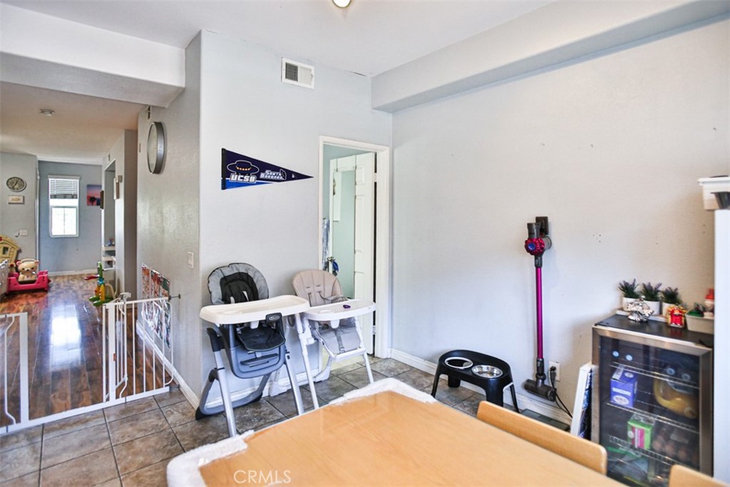 8796 Aspenglow Place, Unit 2 Santee, CA 92071 - Photo 21 of 41 a living room with furniture a rug and white walls