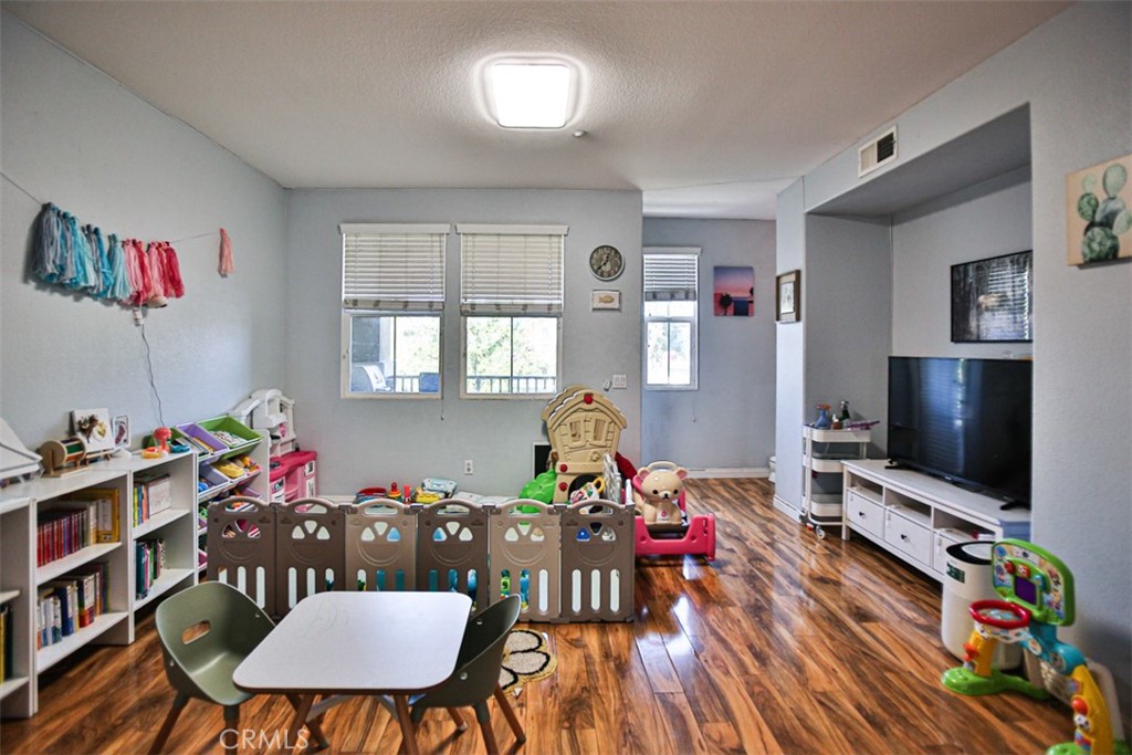 8796 Aspenglow Place, Unit 2 Santee, CA 92071 - Photo 25 of 41 a living room with furniture and a flat screen tv