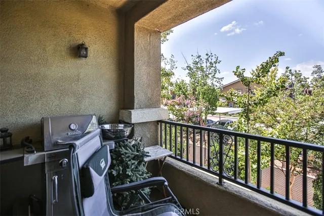 a view of balcony with furniture