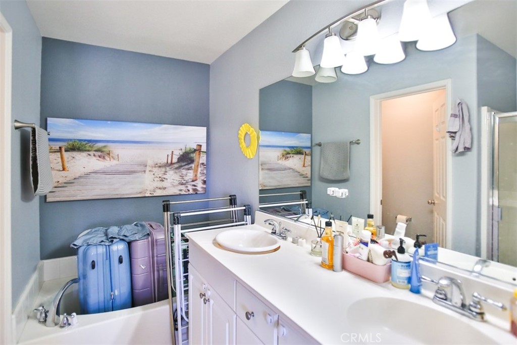 8796 Aspenglow Place, Unit 2 Santee, CA 92071 - Photo 33 of 41 a bathroom with a sink vanity and mirror
