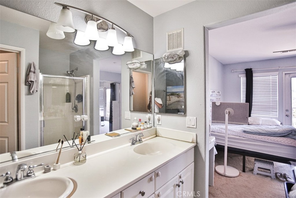 8796 Aspenglow Place, Unit 2 Santee, CA 92071 - Photo 34 of 41 a bathroom with a sink a vanity and a large mirror