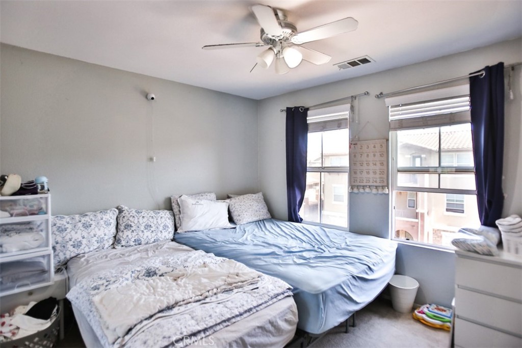 8796 Aspenglow Place, Unit 2 Santee, CA 92071 - Photo 35 of 41 a bedroom with a bed and a large window