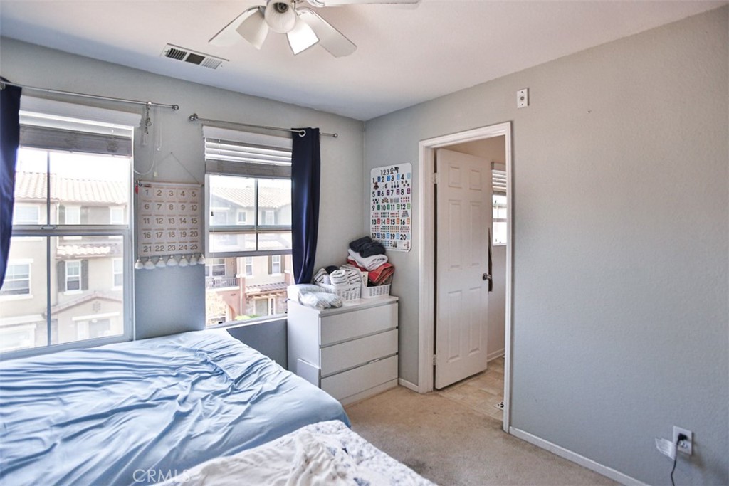 8796 Aspenglow Place, Unit 2 Santee, CA 92071 - Photo 36 of 41 a bedroom with a bed and a window