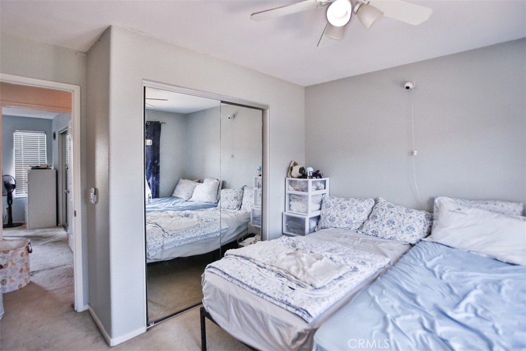 8796 Aspenglow Place, Unit 2 Santee, CA 92071 - Photo 37 of 41 a bedroom with a bed and a chandelier