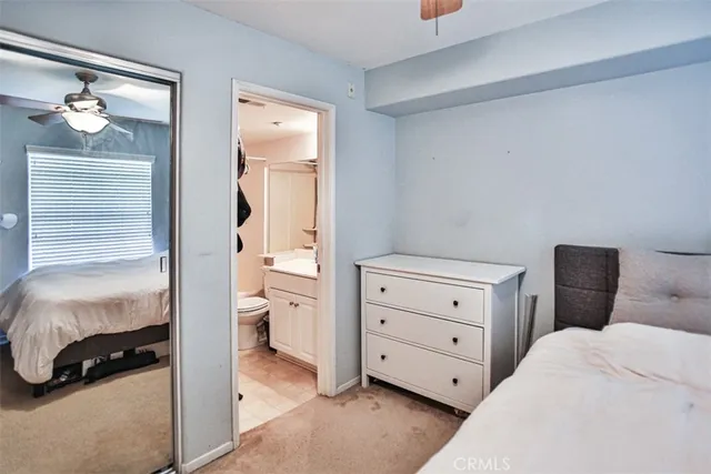 a bedroom with a bed and a closet