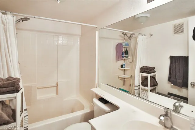 a bathroom with a bathtub and a sink