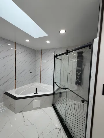 a spacious bathroom with a sink a mirror and a bathtub