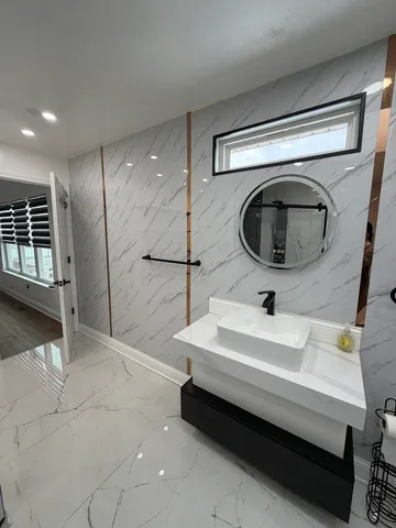 a bathroom with a bathtub and a shower