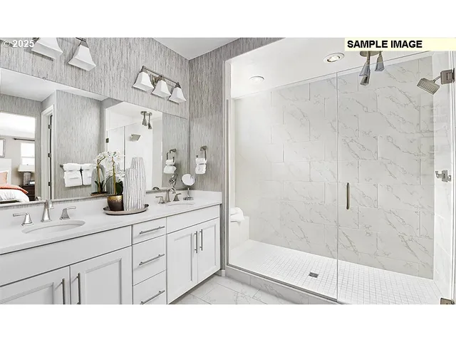 a bathroom with a sink a mirror and shower