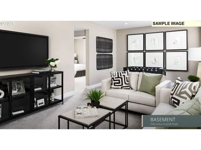 a living room with furniture a flat screen tv and a window