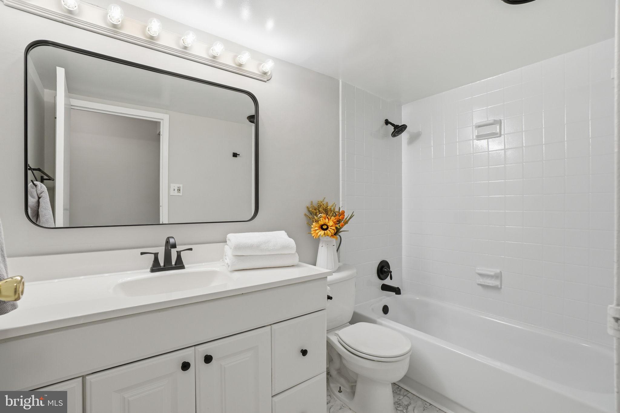 11228 Chestnut Grove Square, Unit 132 Reston, VA 20190 - Photo 11 of 25 Modern bathroom with elegant touches.