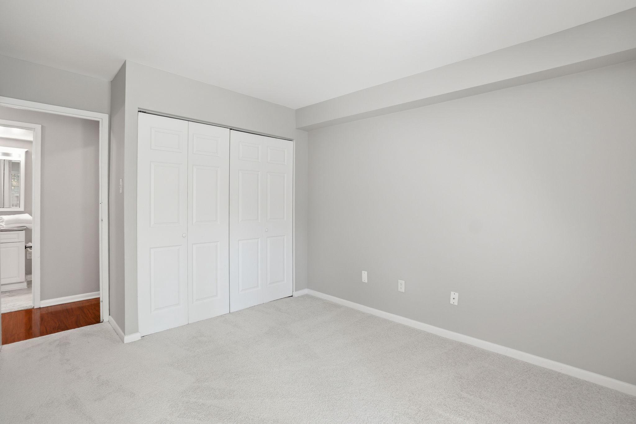 11228 Chestnut Grove Square, Unit 132 Reston, VA 20190 - Photo 12 of 25 Plenty of closet space in second bedroom.