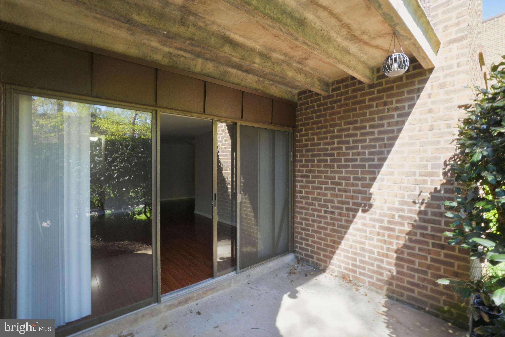 11228 Chestnut Grove Square, Unit 132 Reston, VA 20190 - Photo 19 of 25 Inviting outdoor space with greenery.