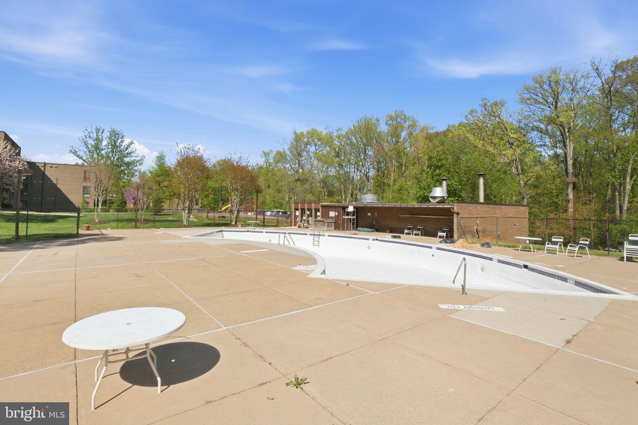 11228 Chestnut Grove Square, Unit 132 Reston, VA 20190 - Photo 20 of 25 Serene poolside retreat awaits summer.